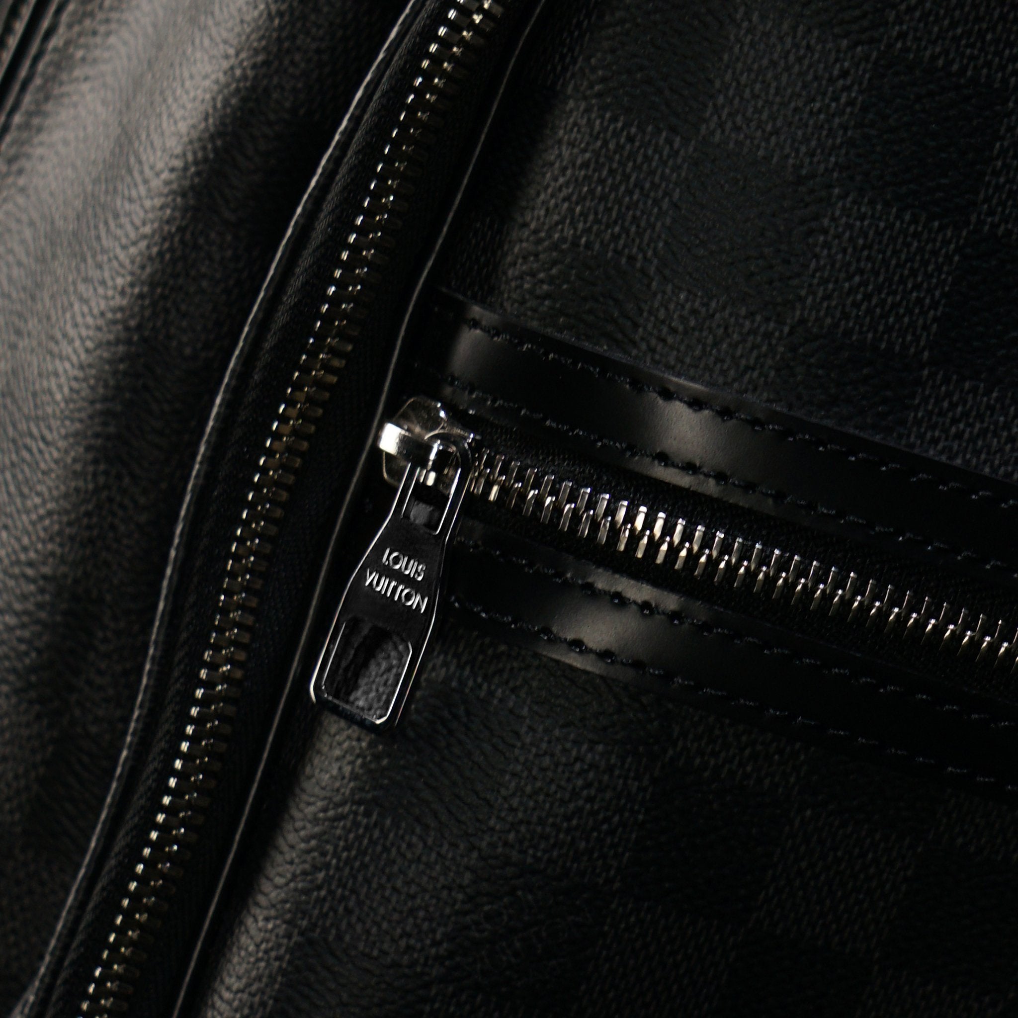 Louis Vuitton-GRAPHITE CANVAS-Colour: Graphite 17.72 x 6.69 inches ( height x width ) Cabin size Two zipped pockets on the exterior Foam padded computer pocket Mobile phone pocket Double zipper for security and convenience D-ring to clip keys-fabriqe.com