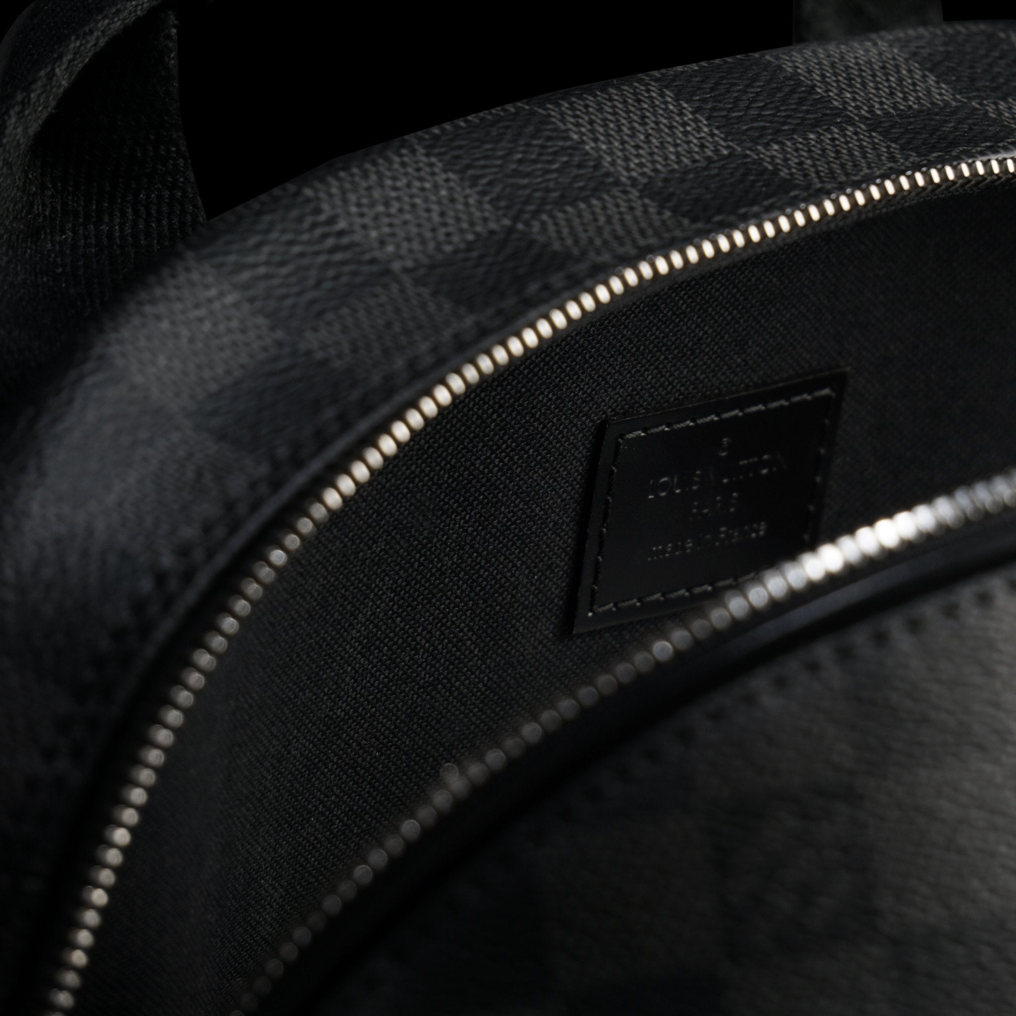Louis Vuitton-GRAPHITE CANVAS-Colour: Graphite 17.72 x 6.69 inches ( height x width ) Cabin size Two zipped pockets on the exterior Foam padded computer pocket Mobile phone pocket Double zipper for security and convenience D-ring to clip keys-fabriqe.com