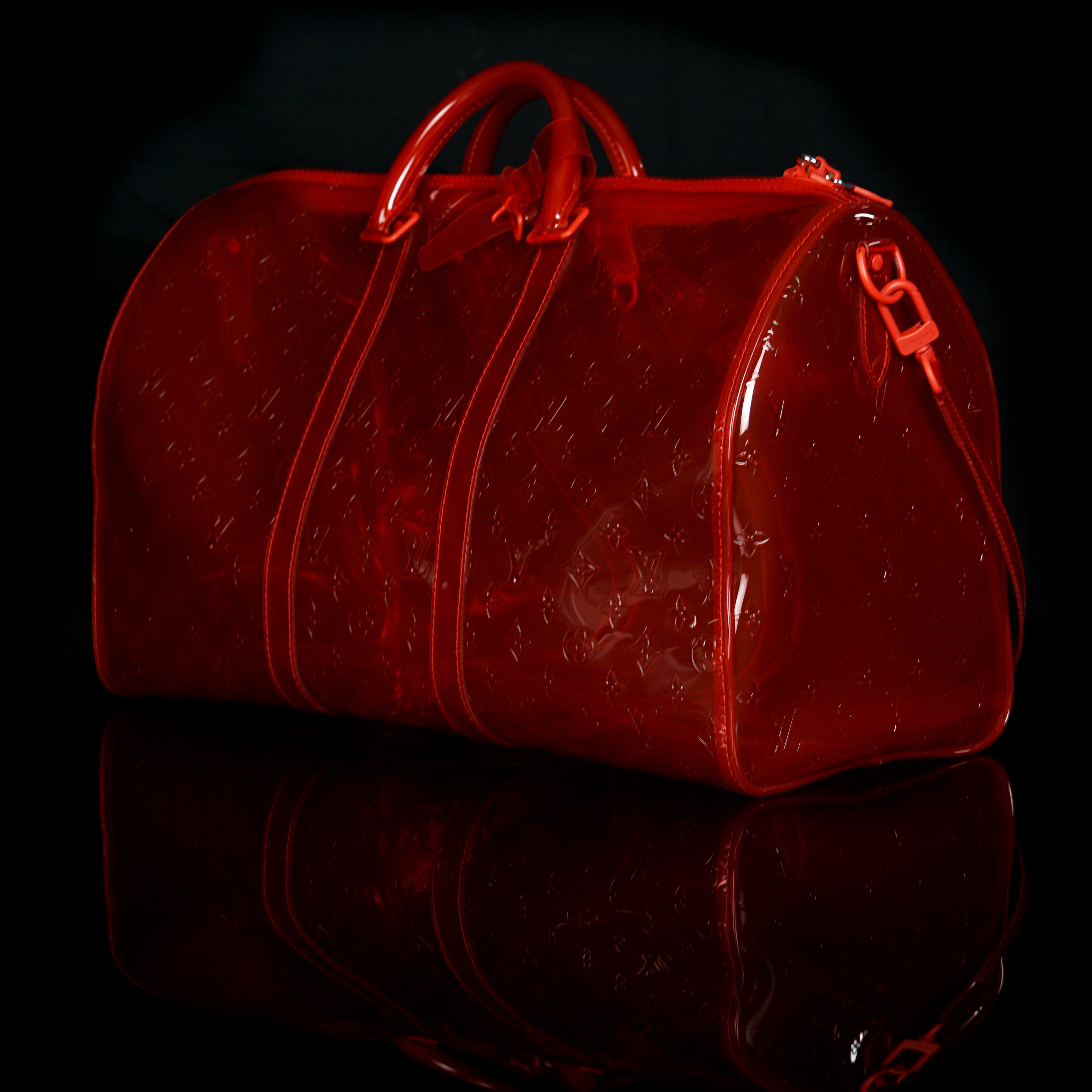 Louis Vuitton-Keepall-19.69 x 11.42 x 9.06 inches ( length x height x width ) L 50 x H 22 x W 29 cm/L 19.7 x H 8.7 x W 11.4 inches Red Transparent embossed Monogram PVC PVC trim Silver-colour and tone-on-tone detailing Top handle for hand or elbow carry L