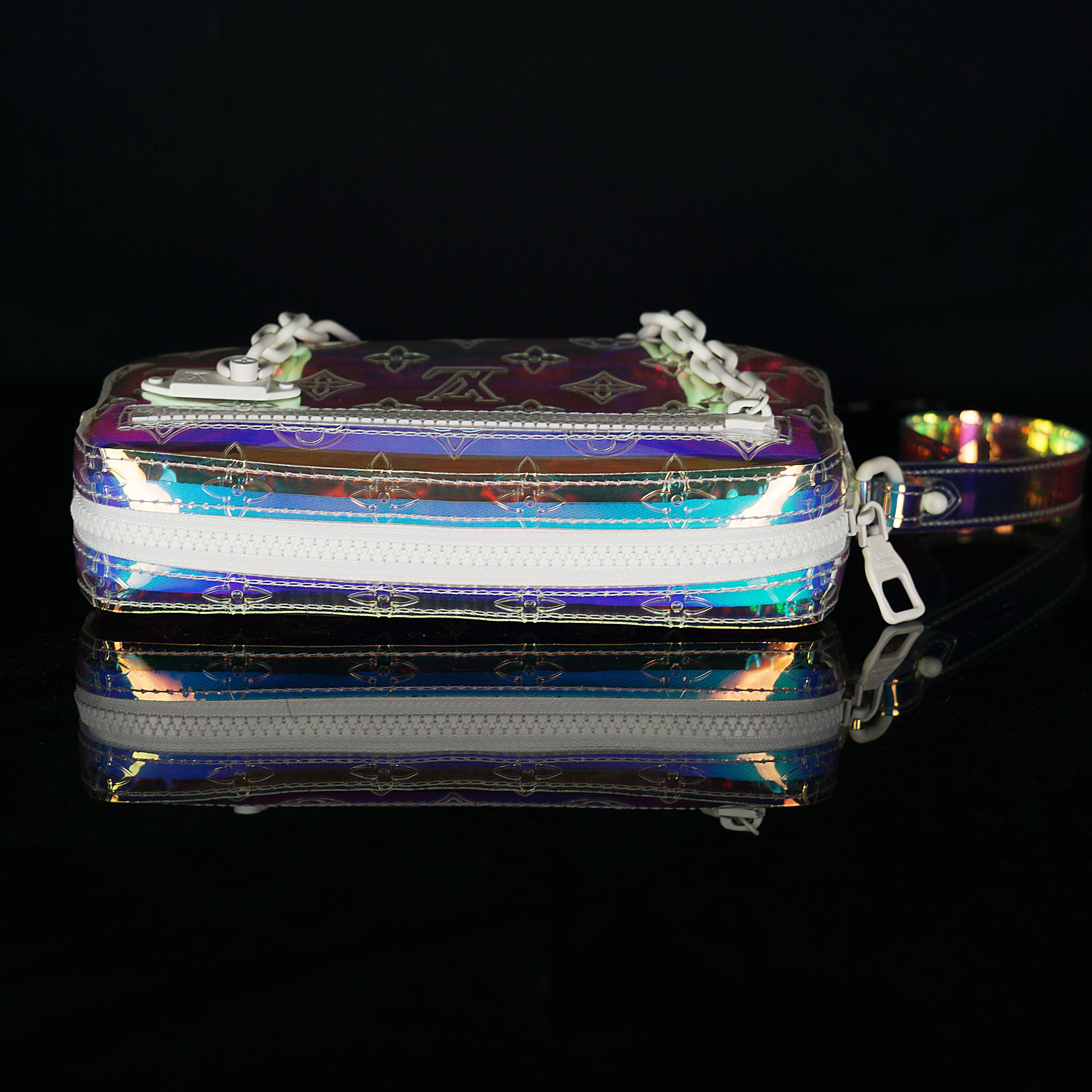 Louis Vuitton-Clutch-23.0 x 11.5 x 4.0 cm (Length x height x width ) L 8.4 x H 4.7 x W 1.9 inches Highly resistant PVC Highly resistant PVC and calf-leather trim Mat-white hardware Zipped compartment Zipped front pocket Removable strap-fabriqe.com