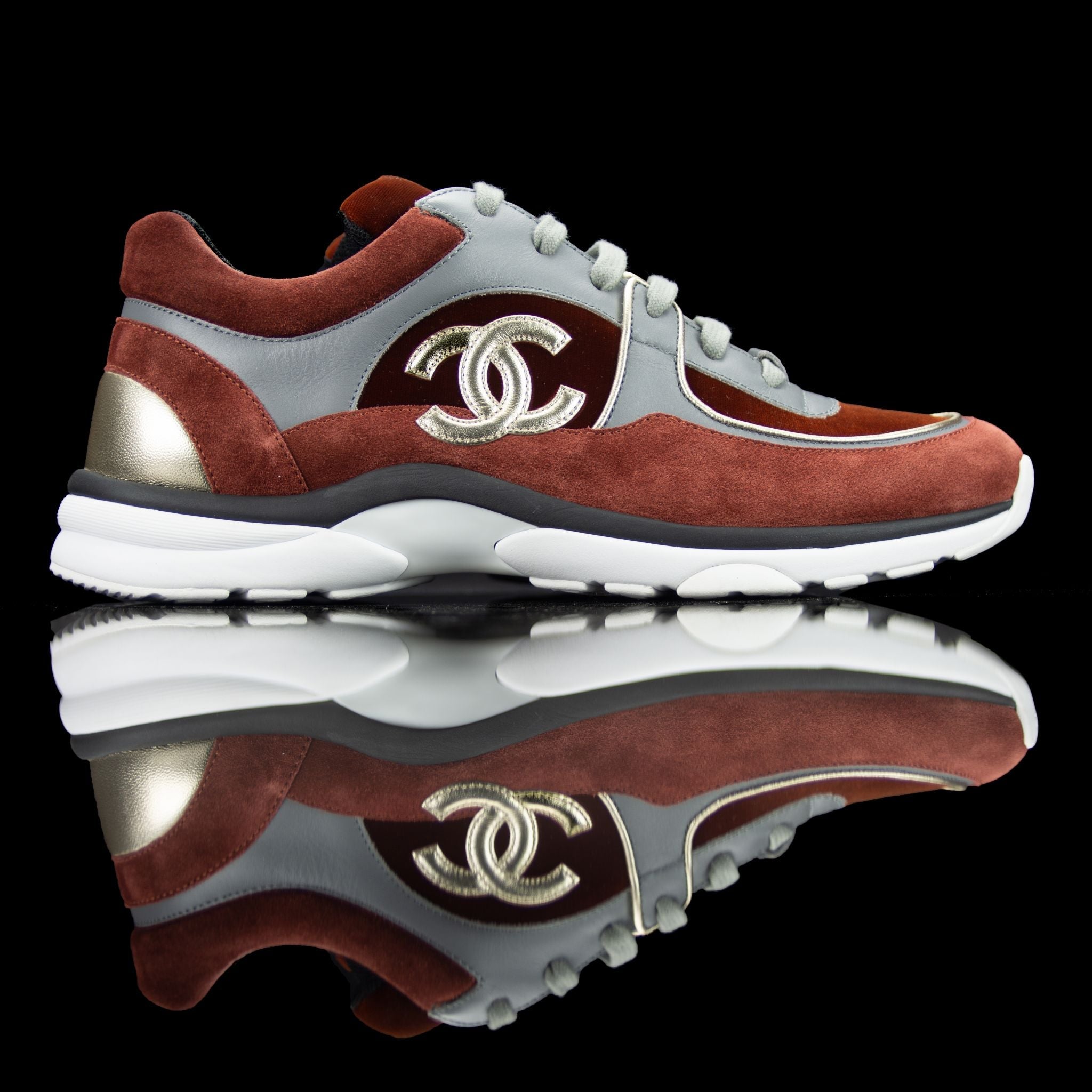 Chanel-CC Sneakers-Pre Order Duration (3-5 Working Days) CC Logo on side Maroon, Grey, Bronze Rubber Sole 2018 Release Limited Stock Chanel CCs crafted in mixed fabric sports CC branding on the side. Embellished in Maroon and Grey with a bronze touch. Nyl