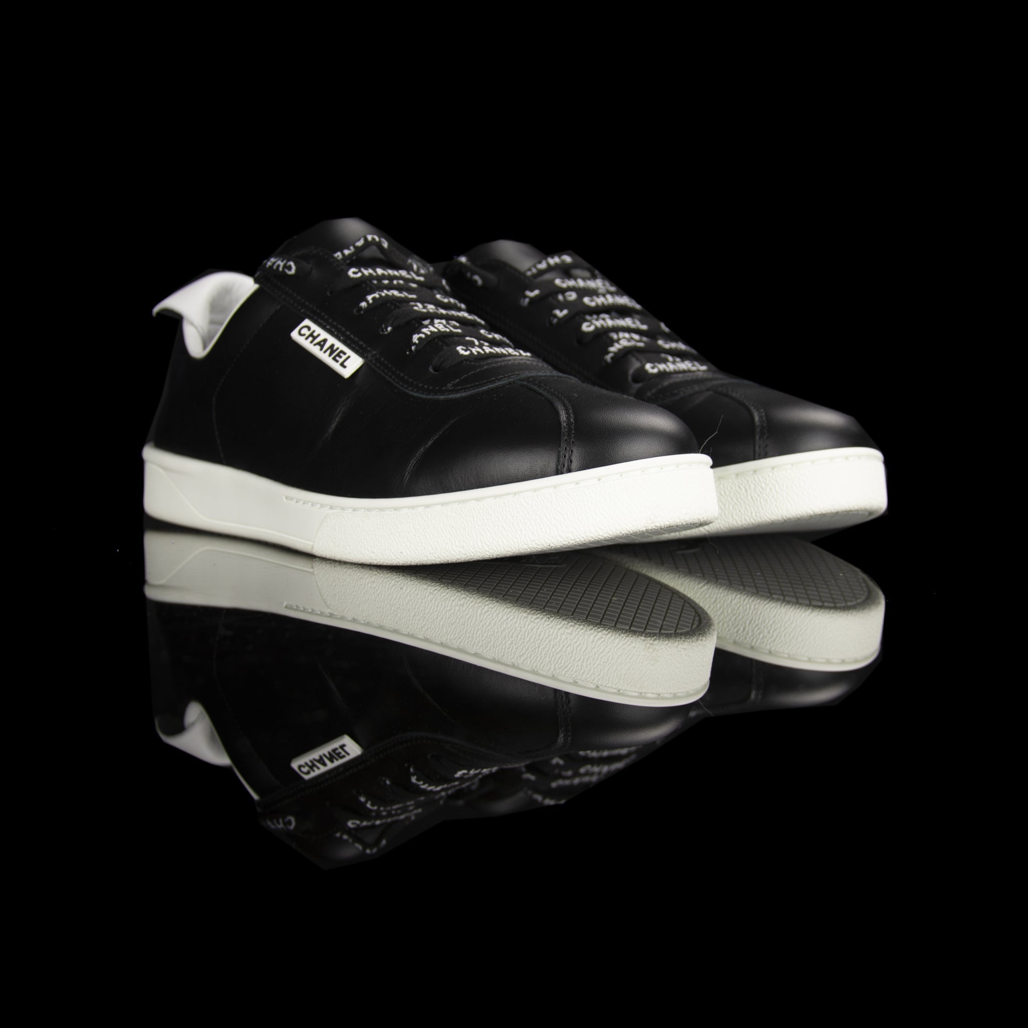 Chanel-Weekend sneakers-Colour: Black, White Mid Sole, White outer sole Limited Edition Calfskin Leather Chanel text on laces White Pull tab Black CC Logo on pull tab-fabriqe.com