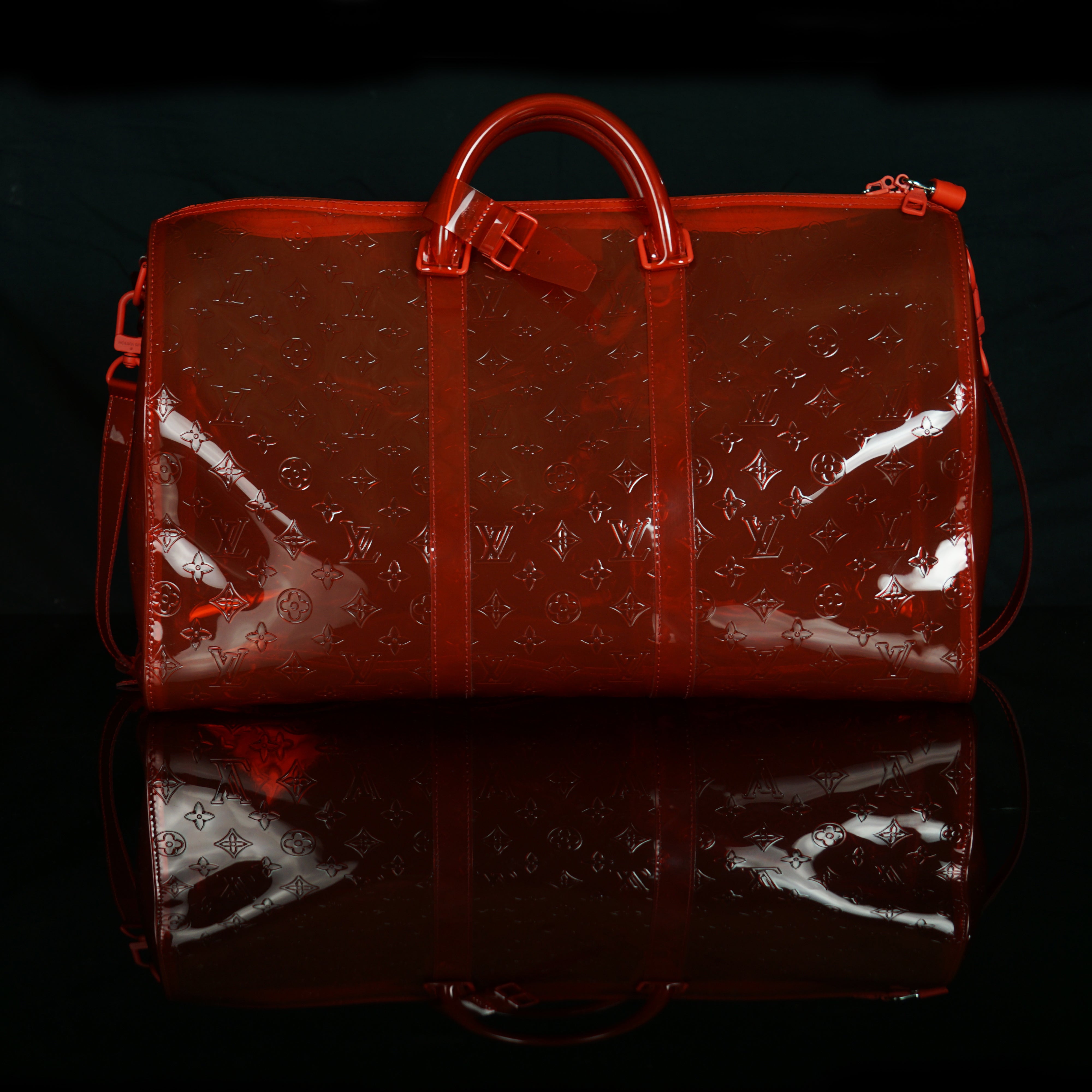 Louis Vuitton-Keepall-19.69 x 11.42 x 9.06 inches ( length x height x width ) L 50 x H 22 x W 29 cm/L 19.7 x H 8.7 x W 11.4 inches Red Transparent embossed Monogram PVC PVC trim Silver-colour and tone-on-tone detailing Top handle for hand or elbow carry L