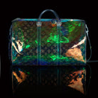 Louis Vuitton-Keepall-L 50 x H 22 x W 29 cm/L 19.7 x H 8.7 x W 11.4 inches Iridescent Prism Transparent embossed Monogram PVC PVC trim White detailing Top handle for hand or elbow carry Leather handle fastener Double zip closure Leather-covered padlock or
