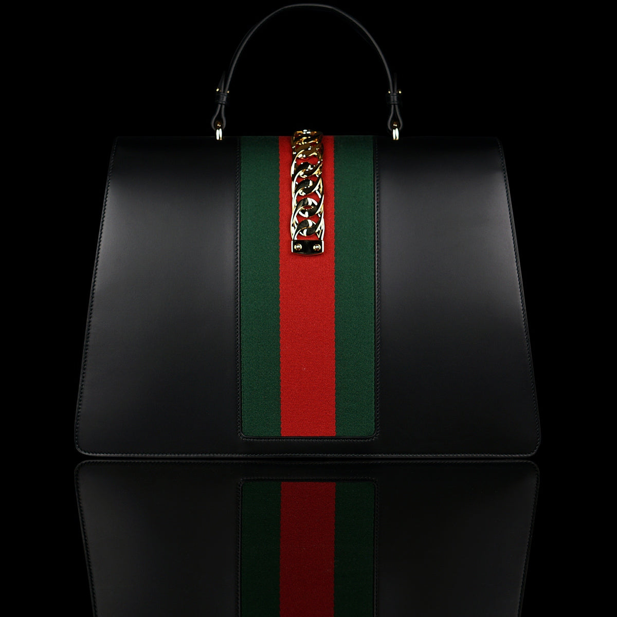 Gucci-Sylvie Bag-Black leather Gucci Flag Gold toned hardware Interior zip and smartphone pockets Handle with 12cm drop Detachable shoulder strap with 41cm drop Nylon Web detail with metal chain and buckle closure Made in Italy-fabriqe.com