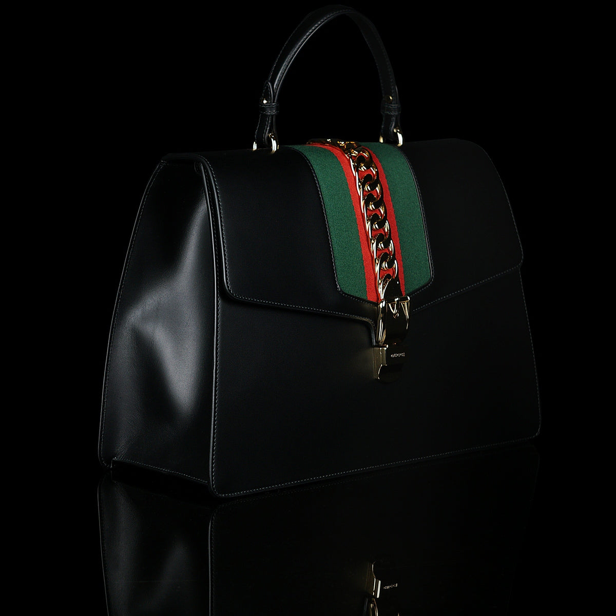 Gucci-Sylvie Bag-Black leather Gucci Flag Gold toned hardware Interior zip and smartphone pockets Handle with 12cm drop Detachable shoulder strap with 41cm drop Nylon Web detail with metal chain and buckle closure Made in Italy-fabriqe.com