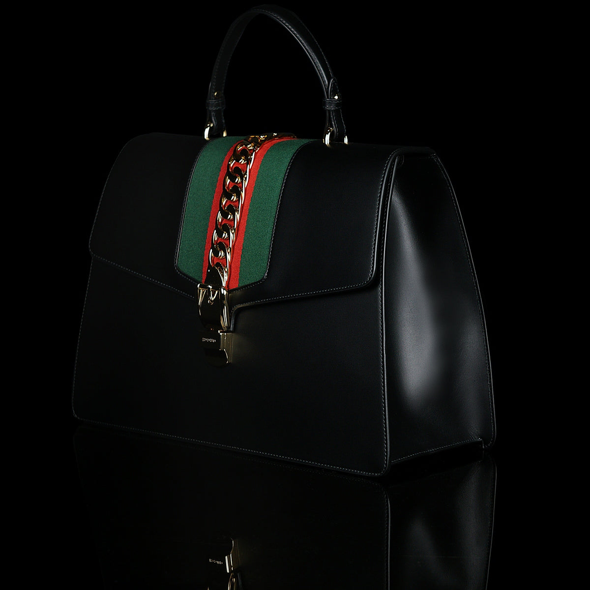 Gucci-Sylvie Bag-Black leather Gucci Flag Gold toned hardware Interior zip and smartphone pockets Handle with 12cm drop Detachable shoulder strap with 41cm drop Nylon Web detail with metal chain and buckle closure Made in Italy-fabriqe.com