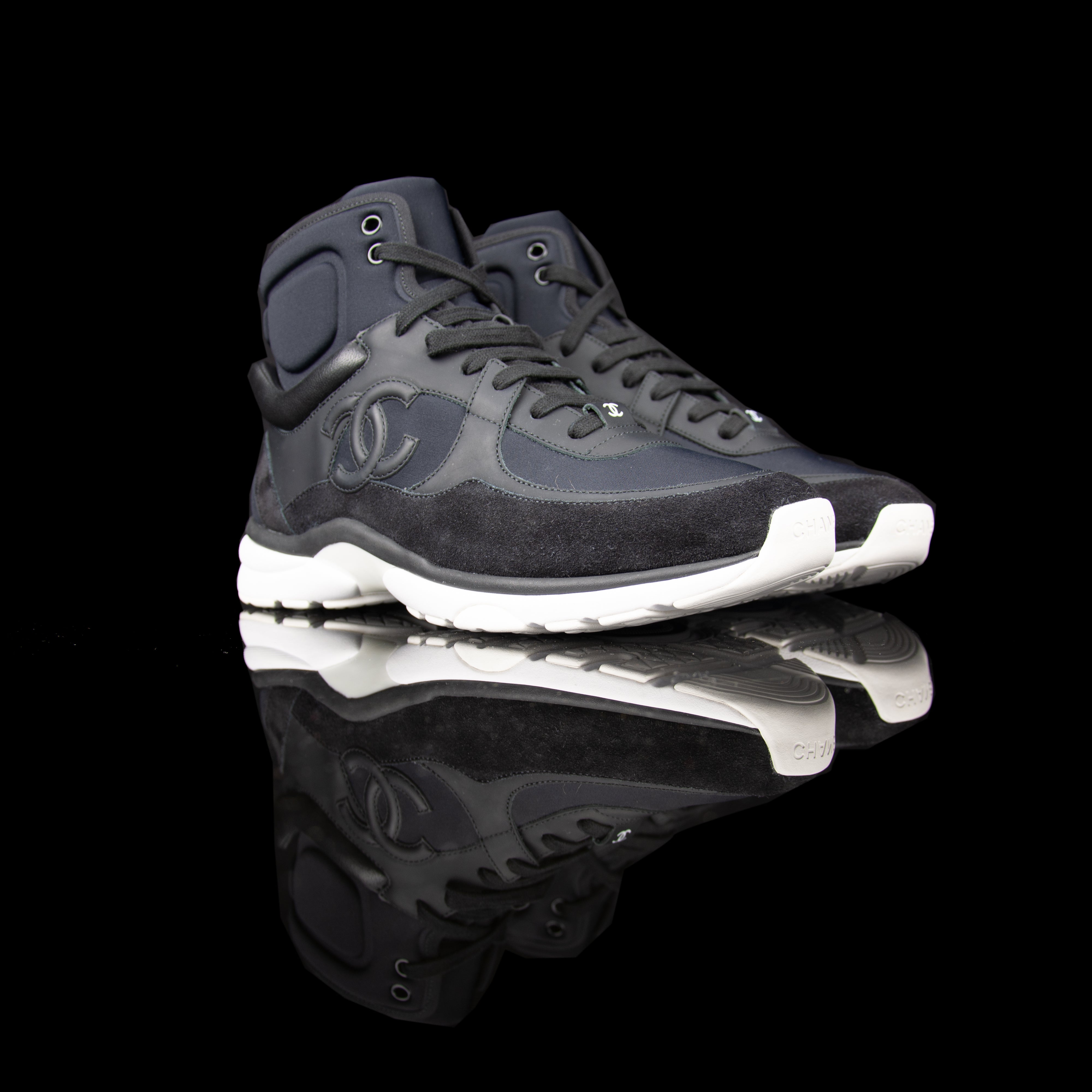 Chanel-CC Sneakers-Pre Order Duration (3-5 Working Days) CC Logo on side Black Black White Rubber Sole 2017 Release Limited Stock Chanel CCs crafted in mixed fabric sports CC branding on the side. Nylon at vamp, leather touch at white and suede line finish grabs the spotlight! In the 2017 limited release the sneakers carry Chanel typography on the rubber sole. Pre-order Exclusive!-fabriqe.com