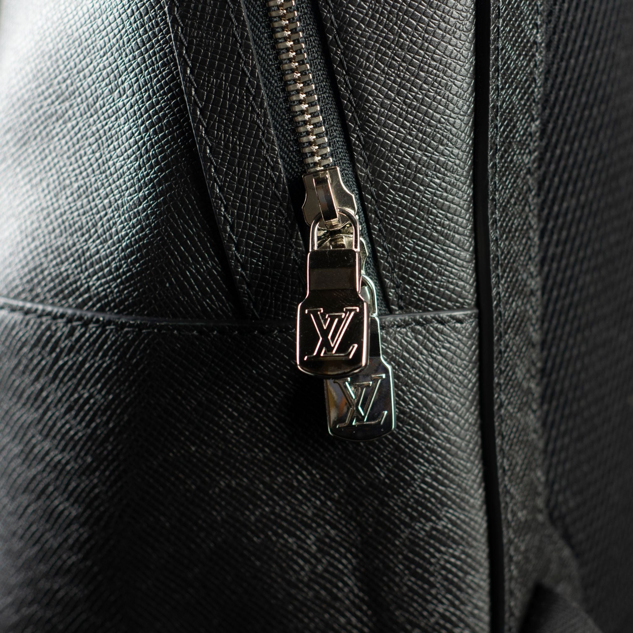 Louis Vuitton-Backpack-11.1 x 16.4 x 6.2 inches Taiga cowhide leather Cowhide leather trim Textile lining Silver-color metal hardware Top handle Zip closure Adjustable and non removable textile shoulder straps Front zipped compartment Mesh back 1 internal