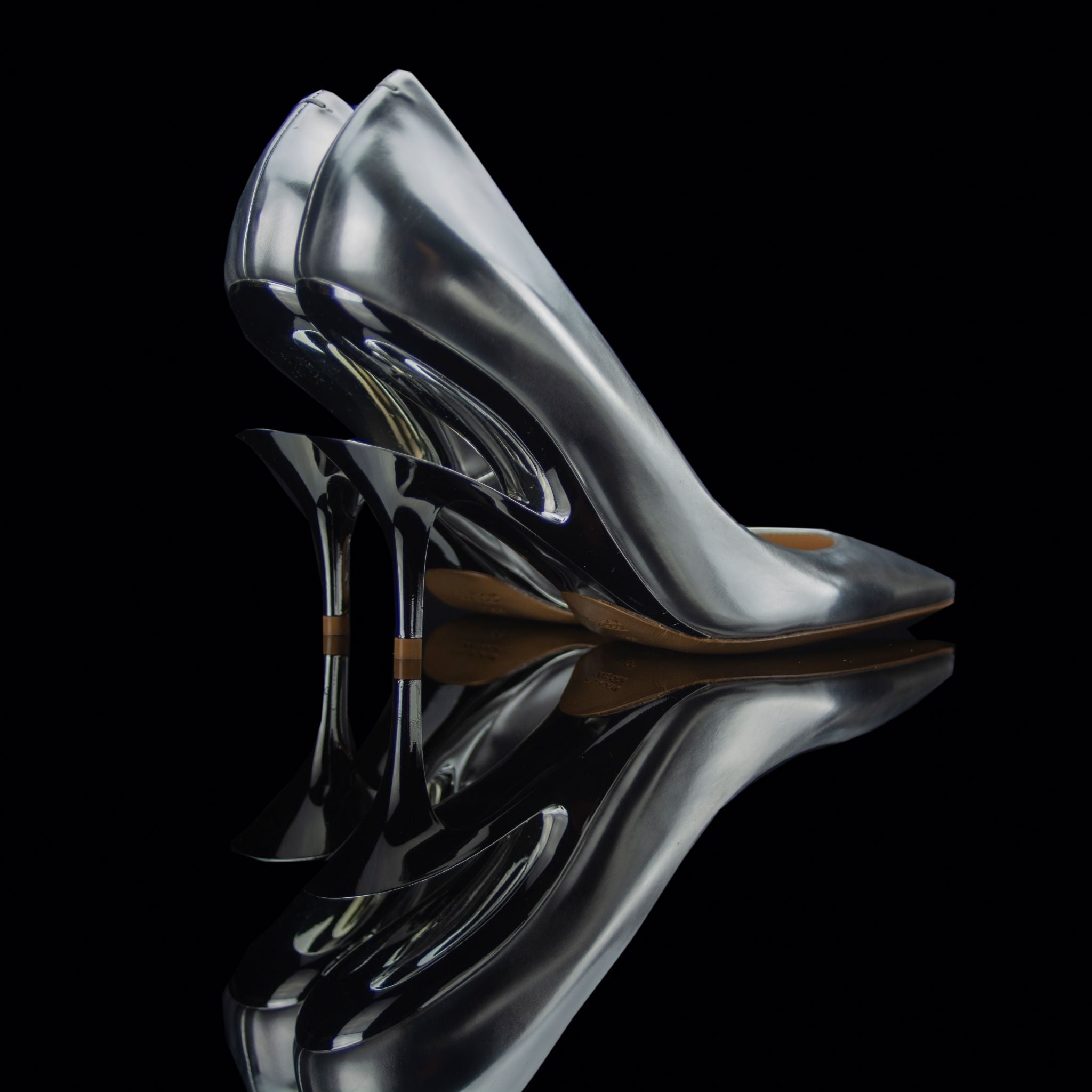 Maison Margiela-Heels-Silver/Chrome Pointed toe Stiletto heel 2108 Release Material: 70% Polyester/30% Cotton Second fabric: 100% Polyurethane Maison Margiela known for its exclusive cut out heels collection brings you fresh release this season. Embellish
