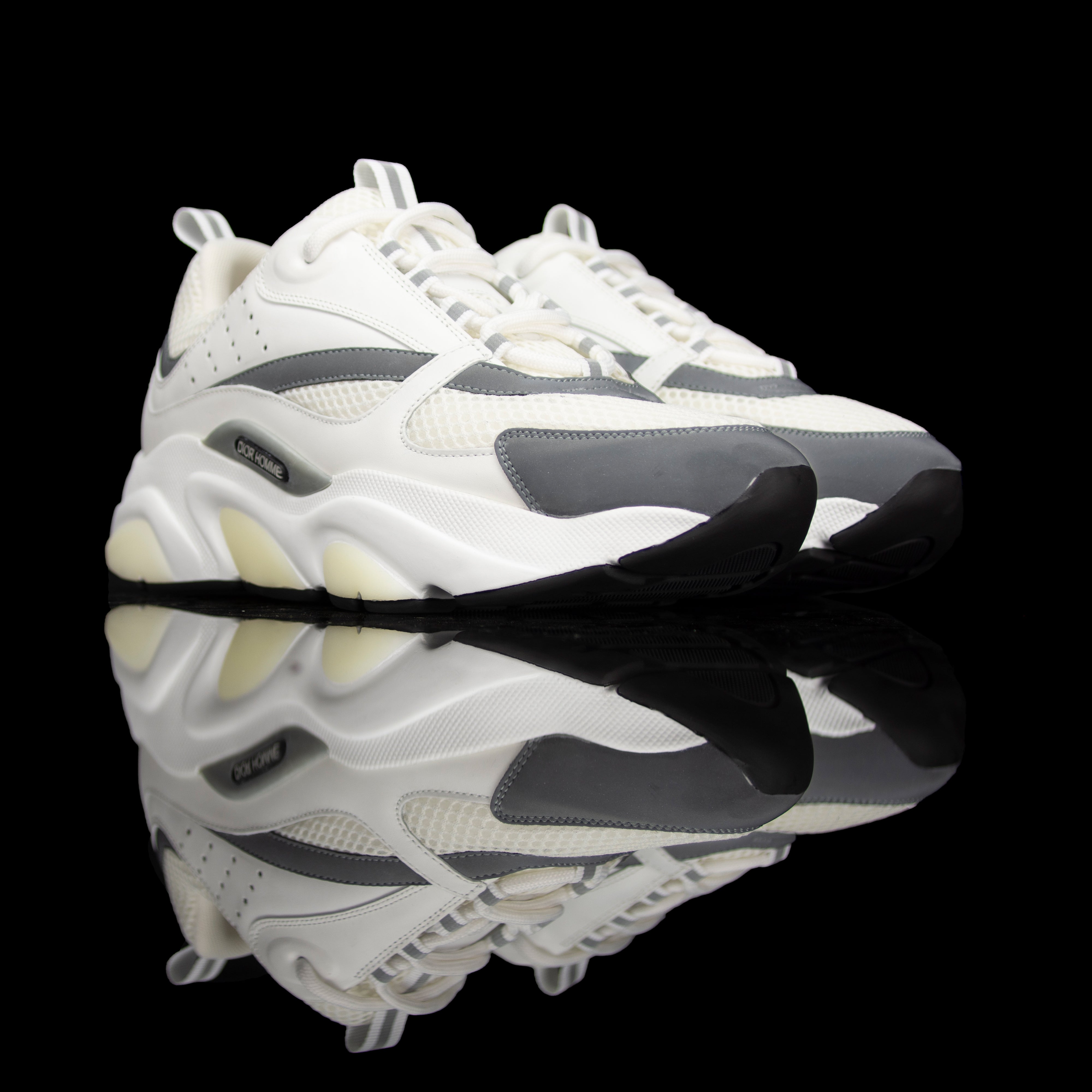 Dior Homme-B22 Sneakers-White technical knit and white calfskin Reflective Material on toe White cotton laces White nylon lining Black nylon pull tab Black rubber sole, textured “Dior Homme” logo “Welded” construction-fabriqe.com