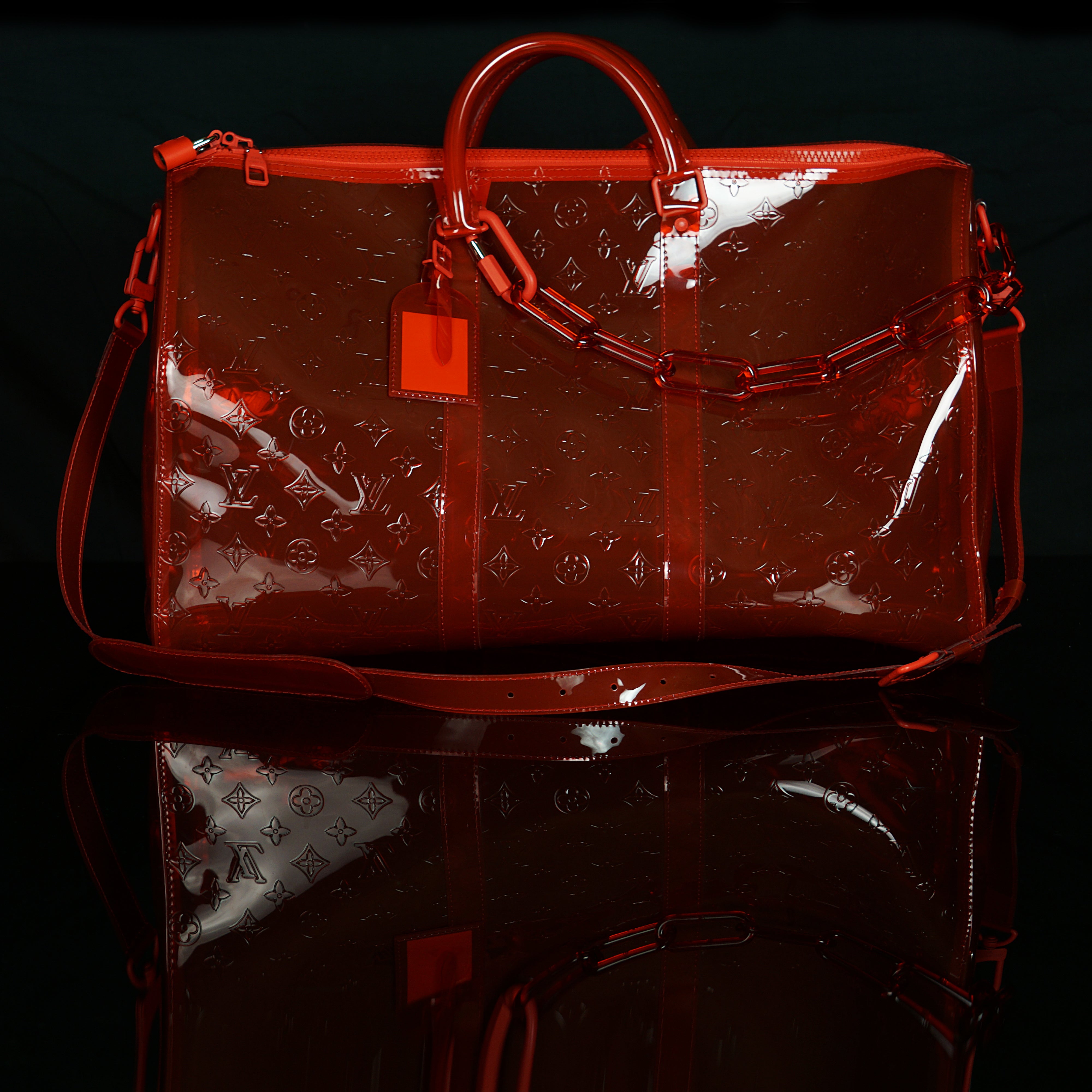 Louis Vuitton-Keepall-19.69 x 11.42 x 9.06 inches ( length x height x width ) L 50 x H 22 x W 29 cm/L 19.7 x H 8.7 x W 11.4 inches Red Transparent embossed Monogram PVC PVC trim Silver-colour and tone-on-tone detailing Top handle for hand or elbow carry L