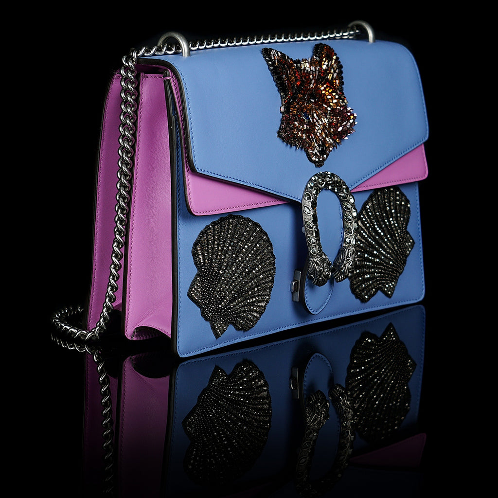 Gucci-Dionysus Shoulder Bag-Selfridges exclusive Blue Leather, a material with low environmental, Pink sides Antique silver-toned hardware Fox's head and Shells design made with sequins Tiger head closure Interior zippered compartment Pocket under the flap External rear pocket Sliding chain strap can be worn as a shoulder strap with 35 drop or can be worn as a top handle with 22 drop Medium size: W30cm x H21cm x D10cm Suede lining with interior pockets Made in Italy The model is 178 cm-fabriqe.com