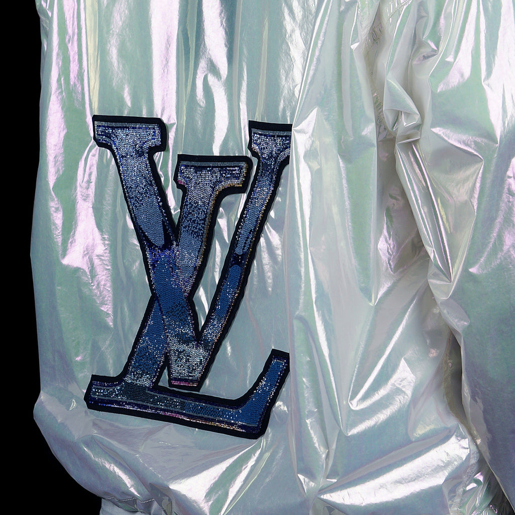 Louis Vuitton-Windbreaker-Colour: Iridescent Style: Windbreaker Material: Transparent Iridescent PVC Virgil Abloh SS19 exclusive pop up item Zipper front Back LV large logo Beaded patches Zippers along front Drawstring bottom Made in Italy-fabriqe.com