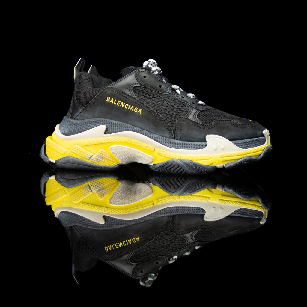 Balenciaga-Triple S-Pre Order Duration (3-5 Working Days) Product Code:534162 w09OG 1087 Colour: Black Yellow Limited Stock Material: Nubuck, Mesh, Rubber Sole Balenciaga Triple S Sneakers colour range is the new 2018 release for sneaker freaks. Crafted i