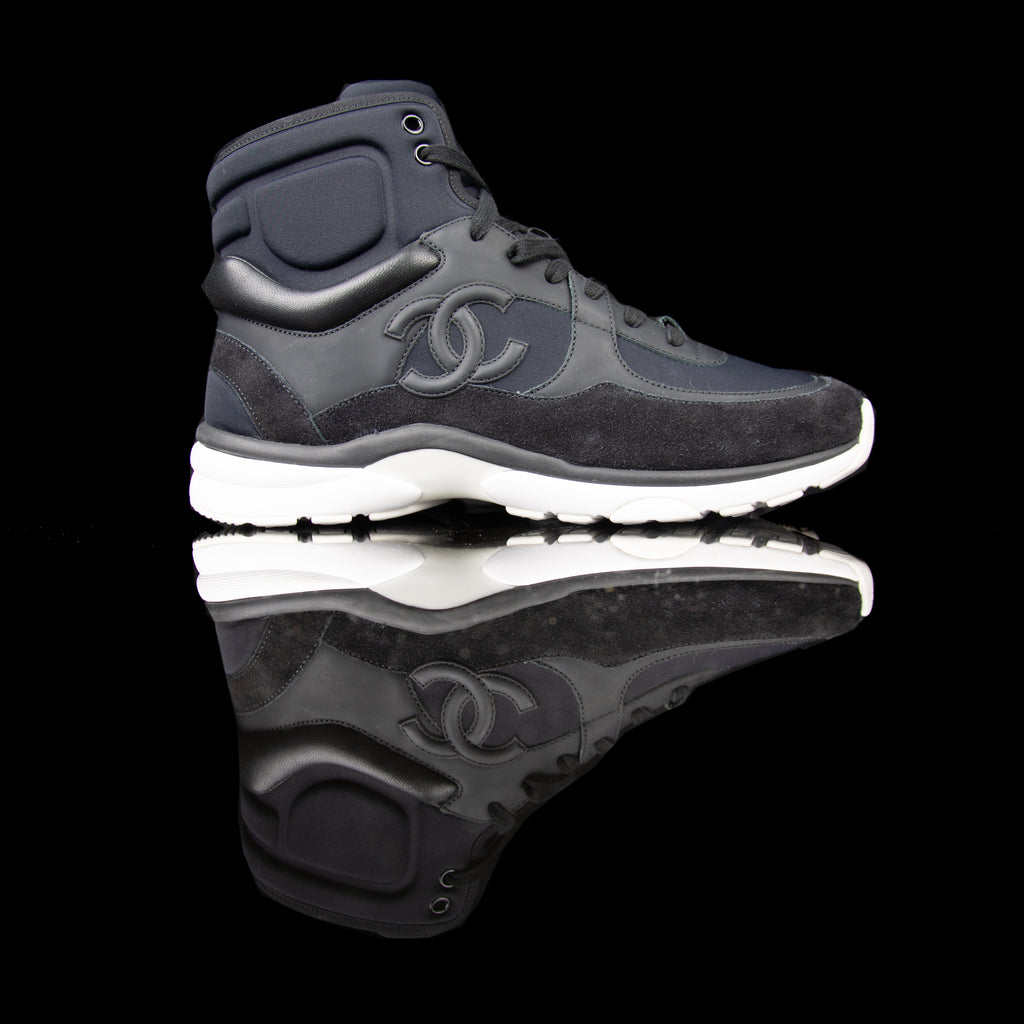 Chanel-CC Sneakers-Pre Order Duration (3-5 Working Days) CC Logo on side Black Black White Rubber Sole 2017 Release Limited Stock Chanel CCs crafted in mixed fabric sports CC branding on the side. Nylon at vamp, leather touch at white and suede line finish grabs the spotlight! In the 2017 limited release the sneakers carry Chanel typography on the rubber sole. Pre-order Exclusive!-fabriqe.com