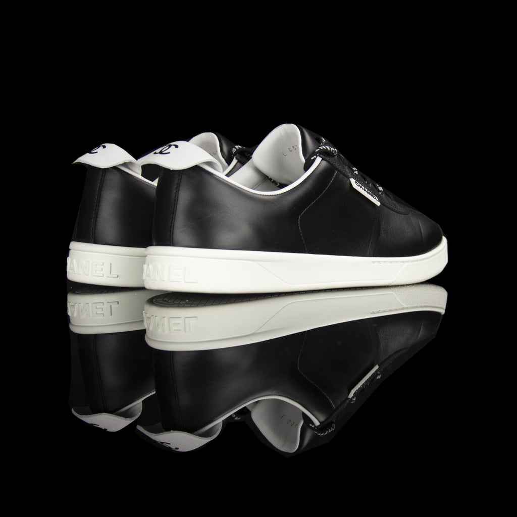 Chanel-Weekend sneakers-Colour: Black, White Mid Sole, White outer sole Limited Edition Calfskin Leather Chanel text on laces White Pull tab Black CC Logo on pull tab-fabriqe.com