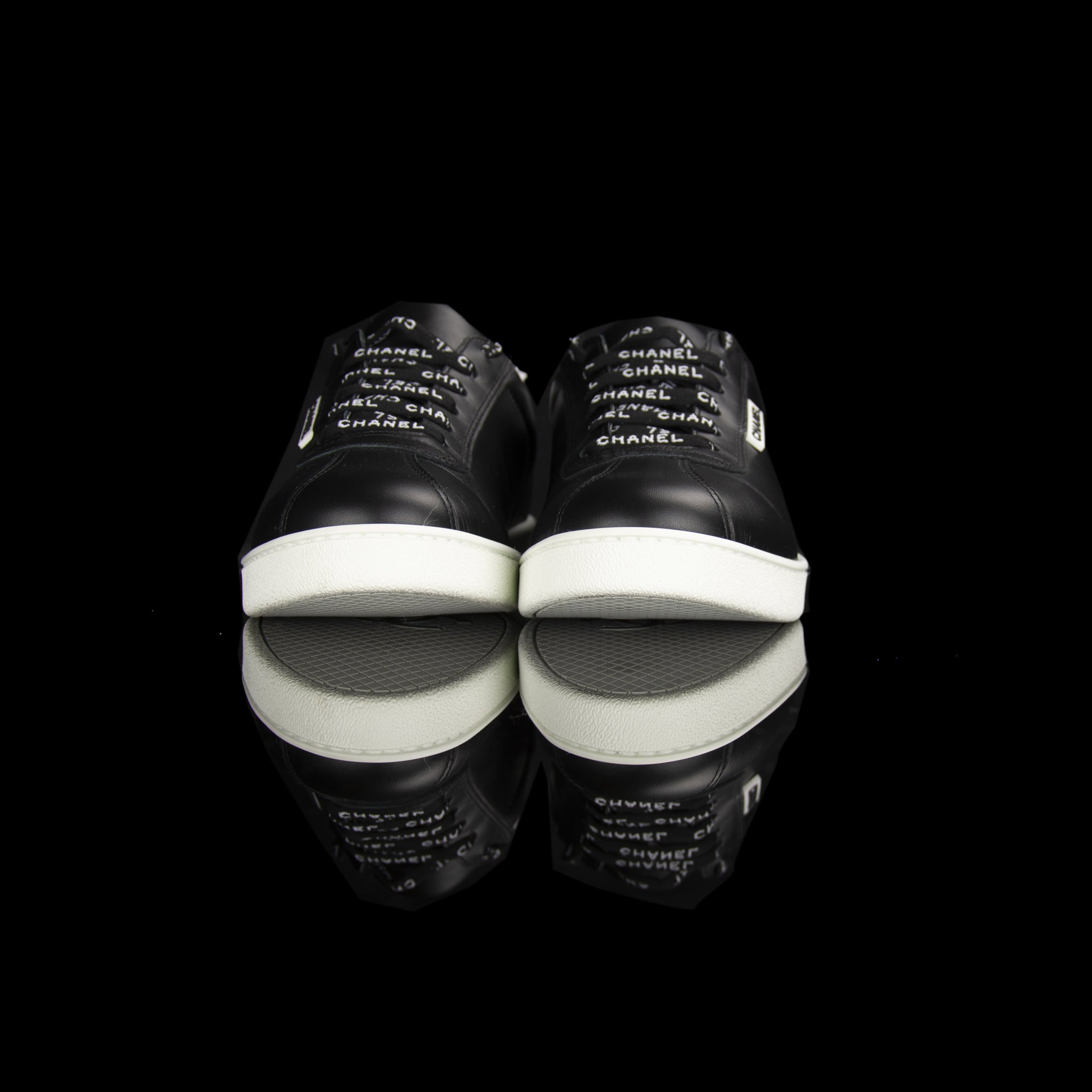 Chanel-Weekend sneakers-Colour: Black, White Mid Sole, White outer sole Limited Edition Calfskin Leather Chanel text on laces White Pull tab Black CC Logo on pull tab-fabriqe.com