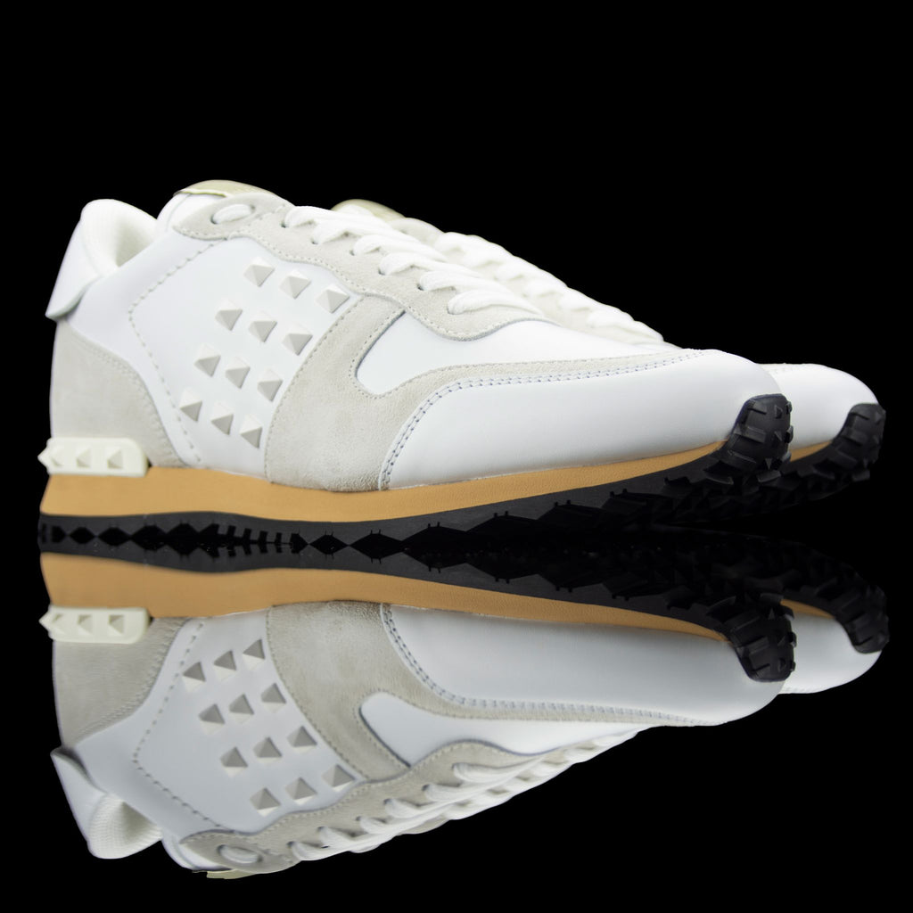 Valentino-Rockstud Sneakers-Product Code: PY2S0748 Colour: Cream/White Material: Leather, Suede, Rubber Sole Valentino Rockstud collection brings you studded sneakers in cream and white. Crafted in leather and suede fabric and based on rubber sole. In add